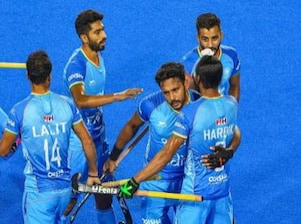 Hardik Singh (8) of India with teammates celebrates after scoring a goal against Spain during a matc